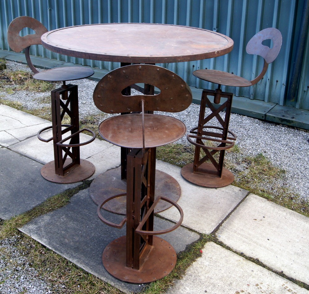 an industrial french bistro table and chairs