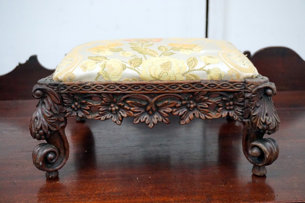 a well carved rosewood victorian footstool