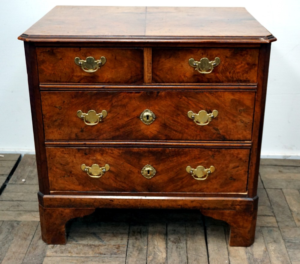 an 18th century walnut chest of drawers