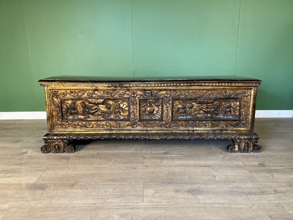 a rare early 17th century walnut gilded italian cassone