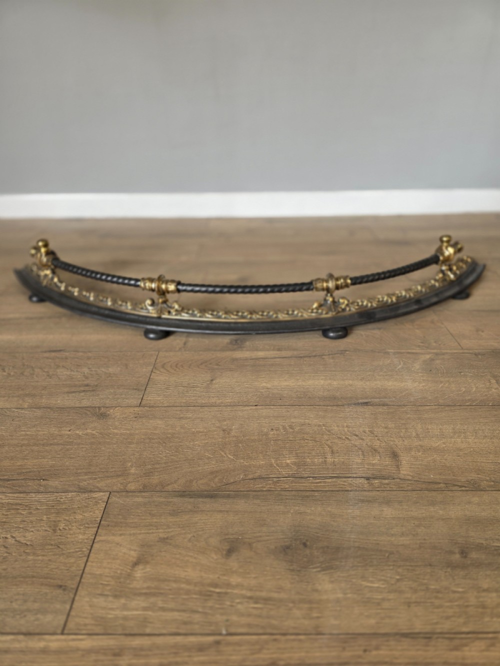 antique 19th century curved bronze and iron fire fender