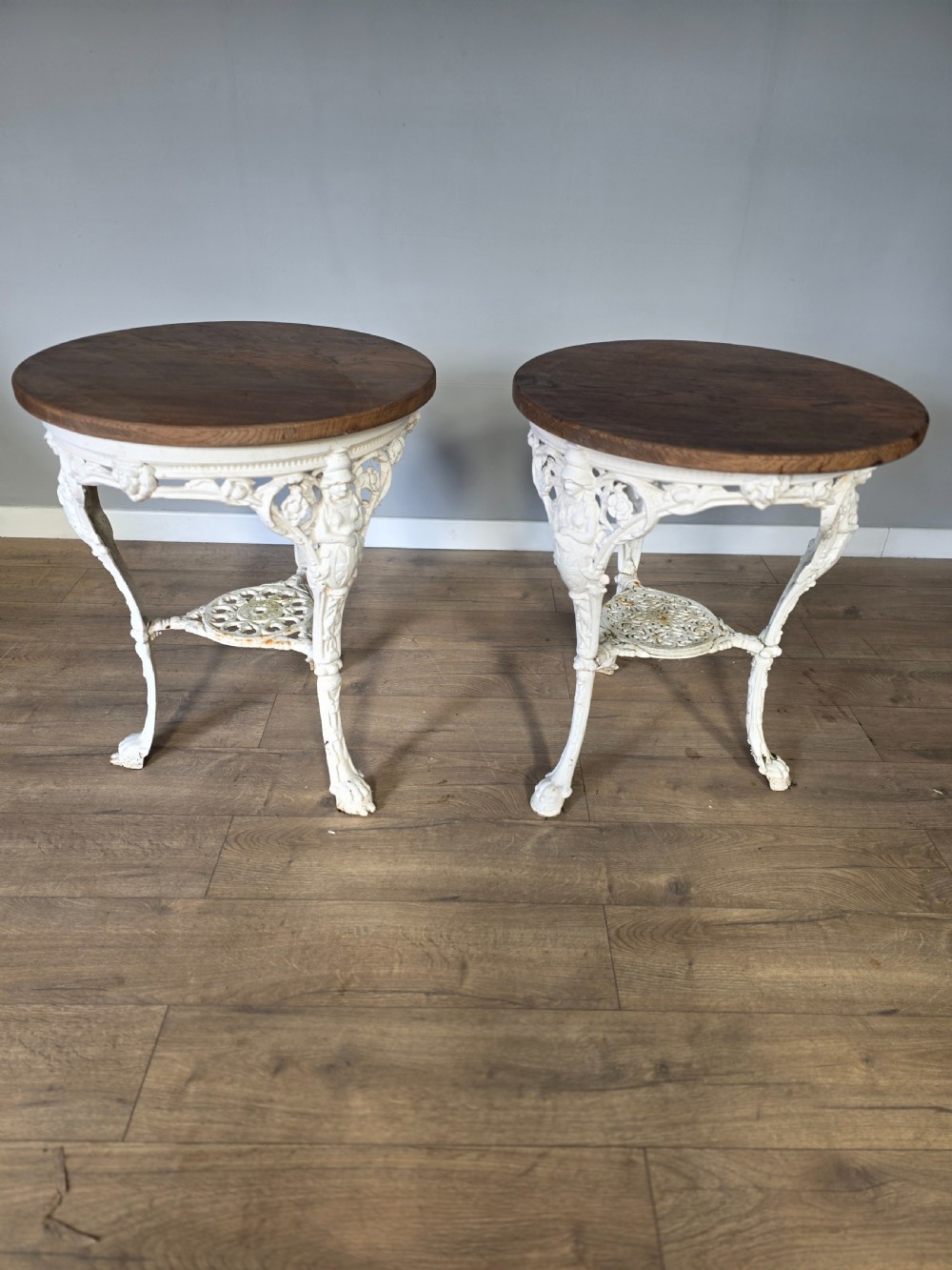 near pair of cast iron victorian britannia pub tables with matching solid oak tops