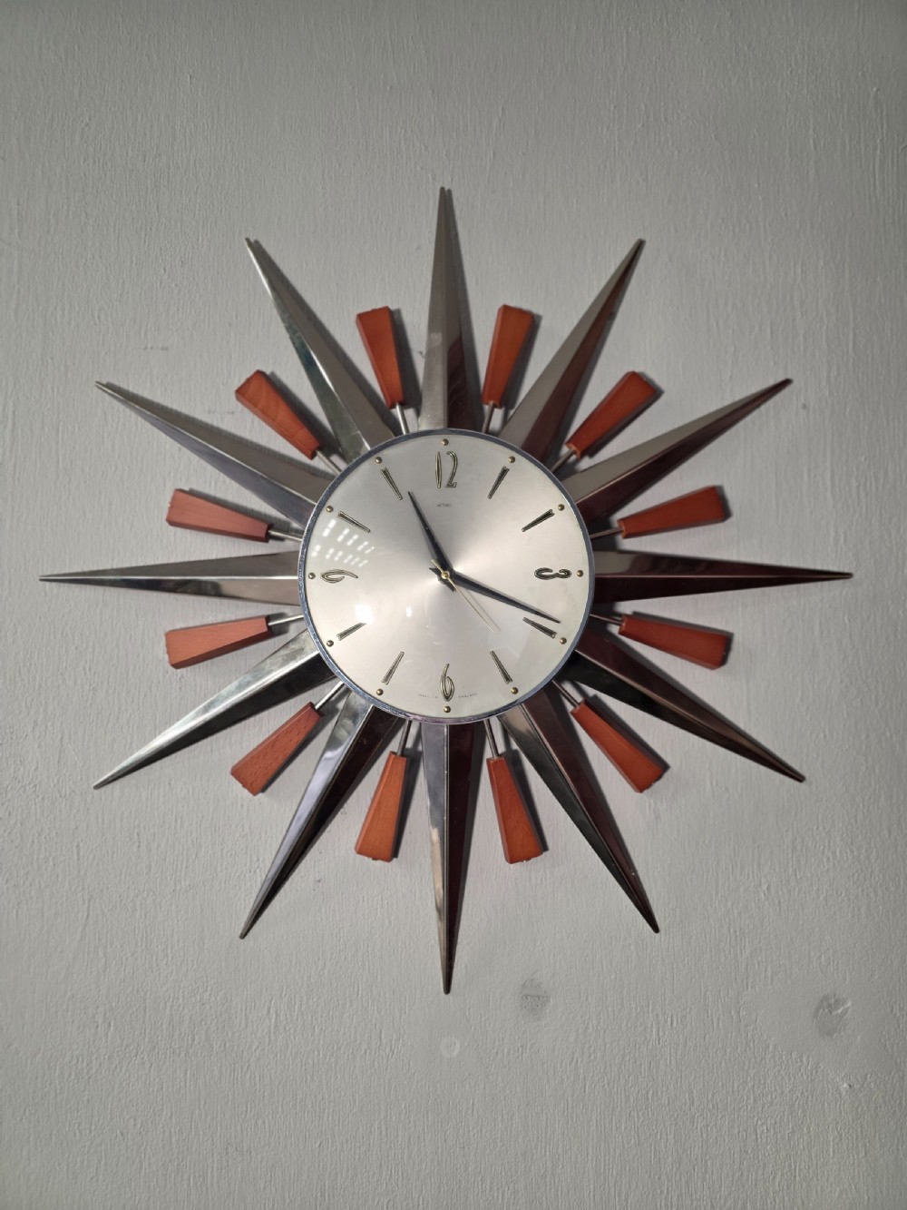 midcentury teak and metal metamec 1970s sunburst wall clock