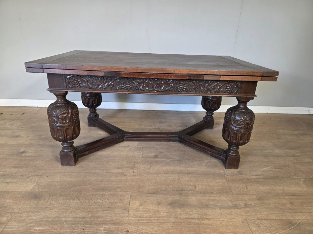 large antique elizabethan style solid oak extending table